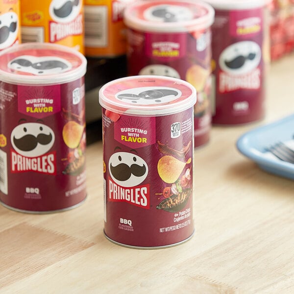 A close up of a red Pringles BBQ potato crisps can.