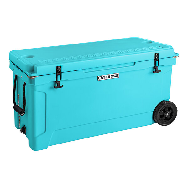 A sky blue CaterGator outdoor cooler with black wheels.