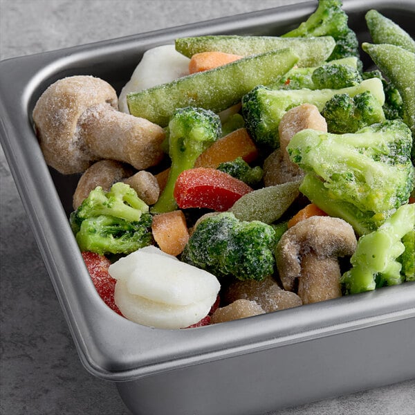 A tray of La Choy Asian-Style Stir-Fry Vegetables with broccoli, carrots, and mushrooms.