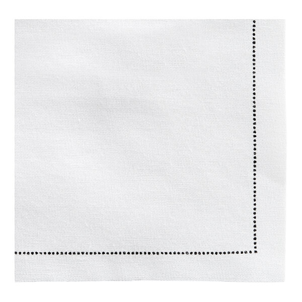 A white napkin with a black dotted border.