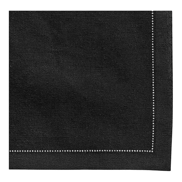 A black napkin with a white diamond border.