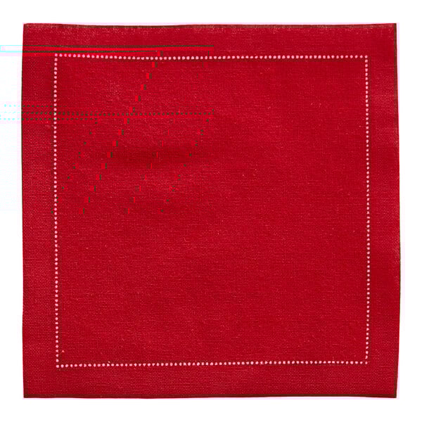 A red cotton cloth napkin with white stitching.
