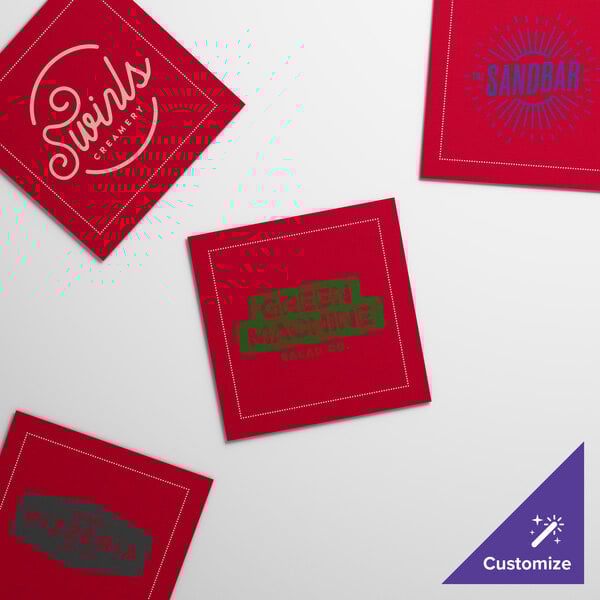 A set of customizable red single-use cotton beverage napkins with various printed logos.