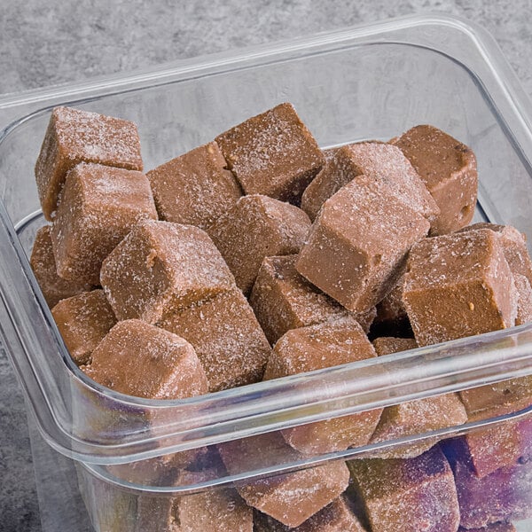 A plastic container filled with brown Live Pure Chocolate Peanut Butter protein smoothie cubes.