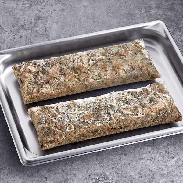 A tray of Phillips Gourmet Mushrooms IQF Seasoned Sautéed Sliced Portabella Mushrooms.