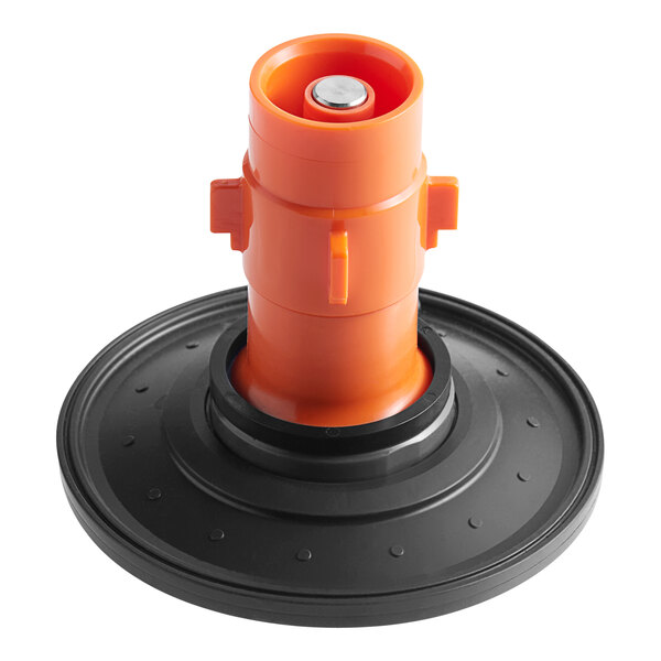 An orange plastic and silver diaphragm assembly for a black American Standard toilet flush valve.