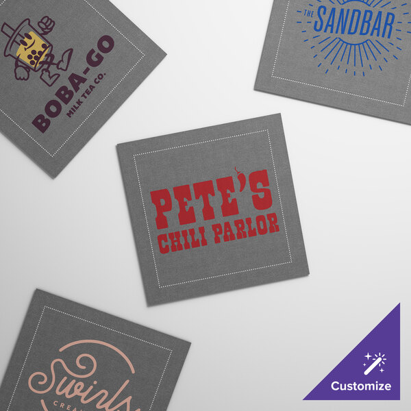 A set of customizable gray single-use cotton dinner napkins featuring various printed logos and designs.