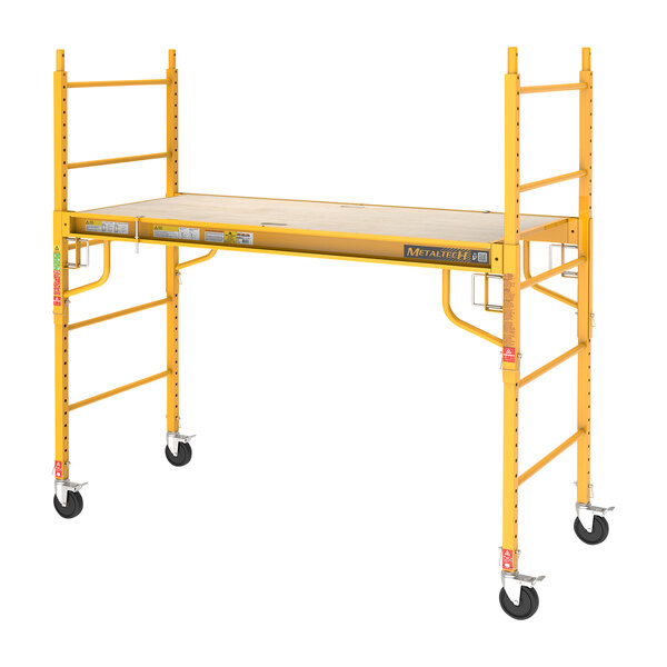 A yellow Metaltech portable baker scaffolding with wheels.