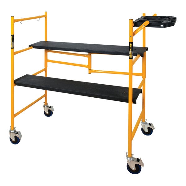 A yellow and black Metaltech folding scaffolding cart with wheels.