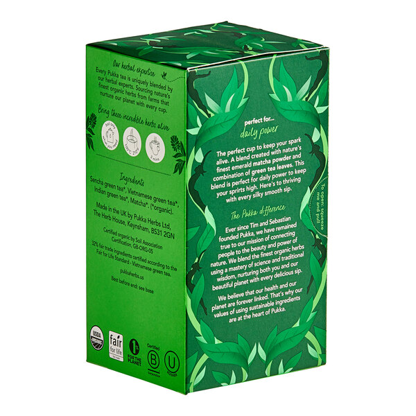 A green box of Pukka Organic Supreme Matcha Green Tea Bags with text and leaves on it.