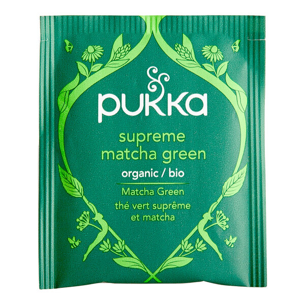 A green Pukka package of Supreme Matcha Green Tea bags with white text and green leaves.