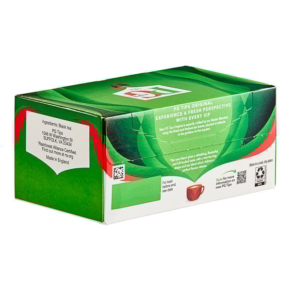 A green and white box of PG Tips Black Pyramid Tea Bags with red and white text.