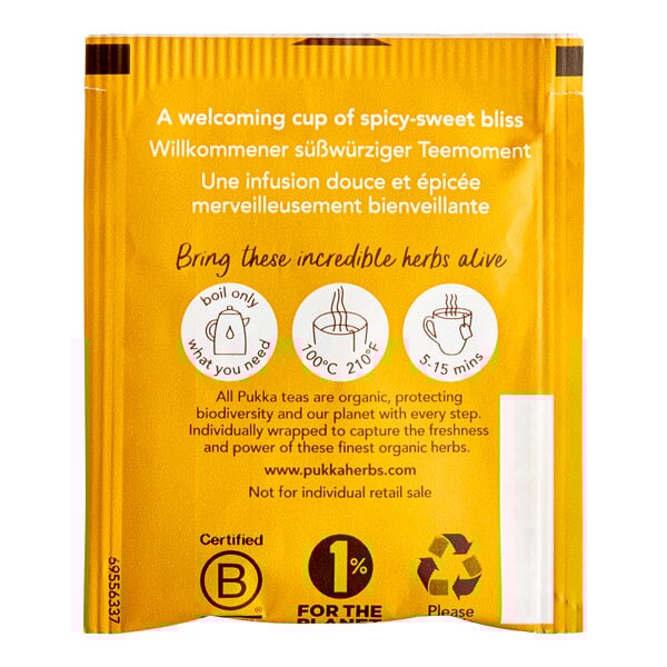A yellow packet of Pukka Organic Lemon, Ginger, and Manuka Honey herbal tea with white and black text.