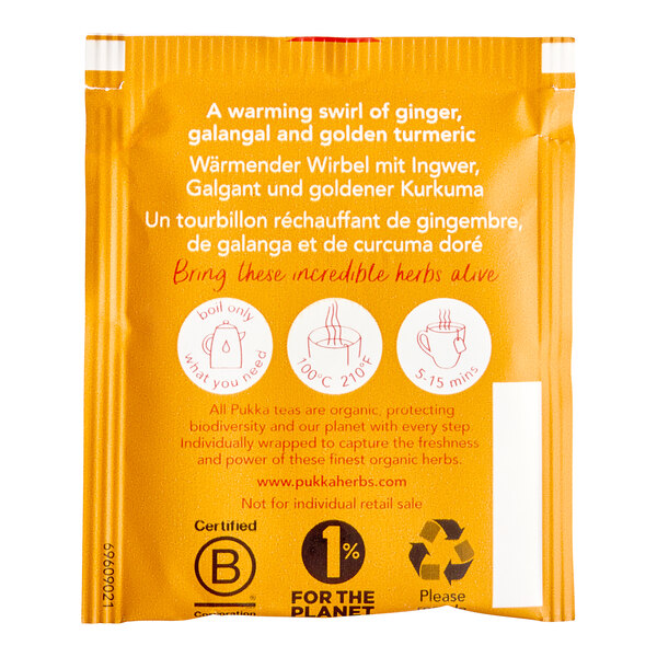 A box of Pukka Organic Three Ginger Herbal Tea Bags with a label.