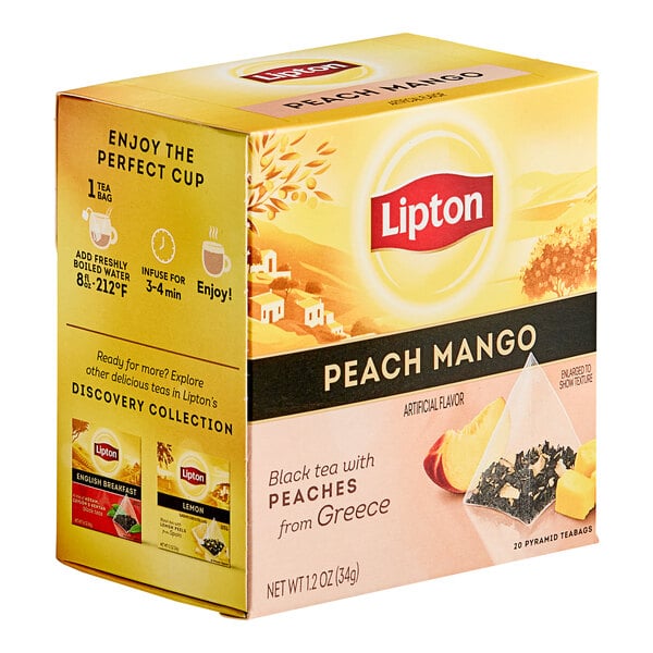 A box of Lipton Peach Mango Black Pyramid Tea Bags on a table.