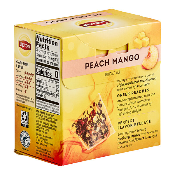 A box of Lipton Peach Mango Black Pyramid Tea Bags on a table.