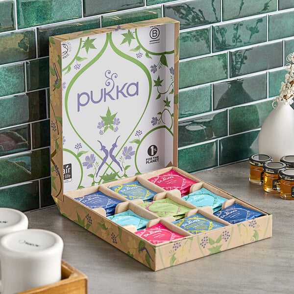 A white Pukka tea box on a table.