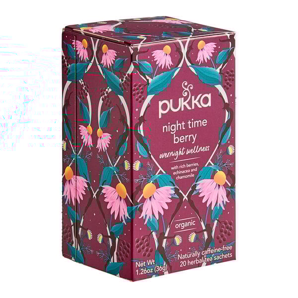 A purple Pukka Organic Night Time Berry Tea box with flowers on it.