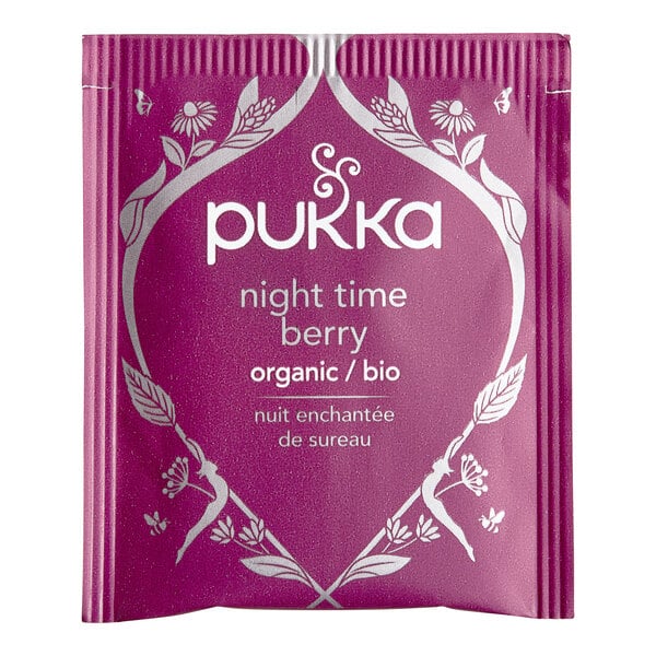 A purple Pukka Organic Night Time Berry Tea box with white text.
