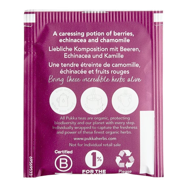 A purple and white Pukka Organic Night Time Berry Tea box with white text and a white circle with a picture of a kettle.