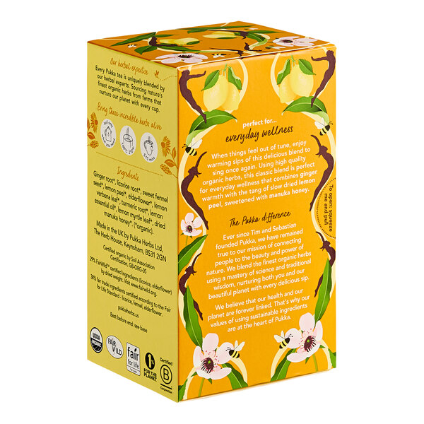 A yellow Pukka tea box with white text and yellow flowers.