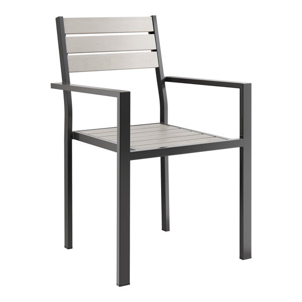 A black Lancaster Table & Seating outdoor chair with gray faux teak slats.