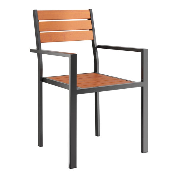 A Lancaster Table & Seating outdoor chair with a black frame and brown faux teak slat seat.