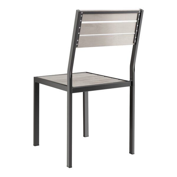 A black outdoor chair with a gray faux teak seat and back.
