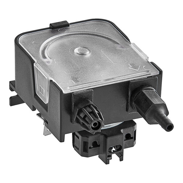 A black and clear plastic Noble Warewashing rinse aid dosing pump with two connectors.