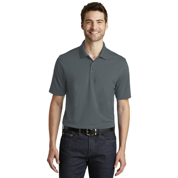 A man wearing a graphite Port Authority short sleeve polo shirt.