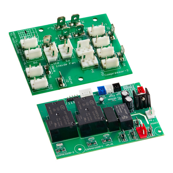 The Avantco main/wiring board kit with two green circuit boards with white and black components.