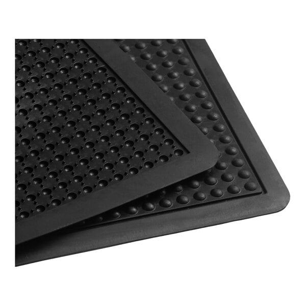 A black rubber anti-fatigue and anti-slip mat with a bubble surface and beveled edge.