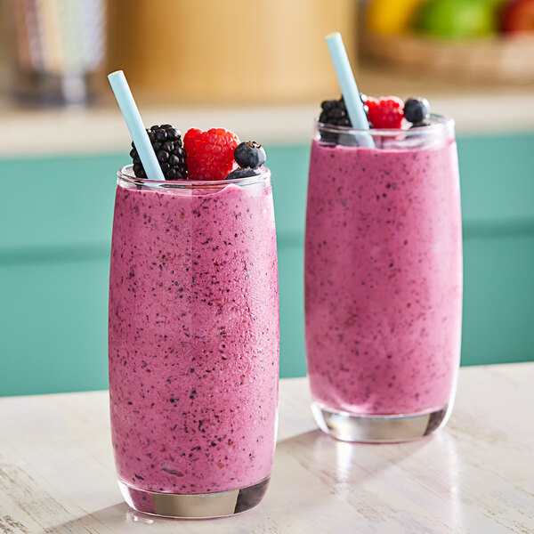 Two glasses of smoothie with Wyman's Triple Berry Blend in them.