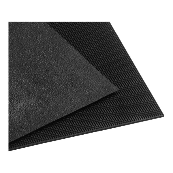 A black rubber entrance mat with a textured surface and beveled edges.