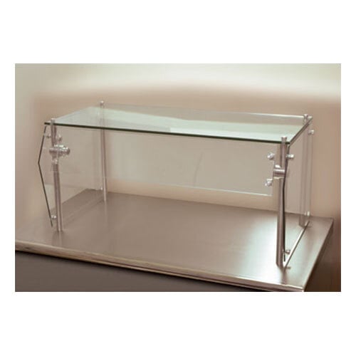 An Advance Tabco single tier food shield with glass top on a counter.