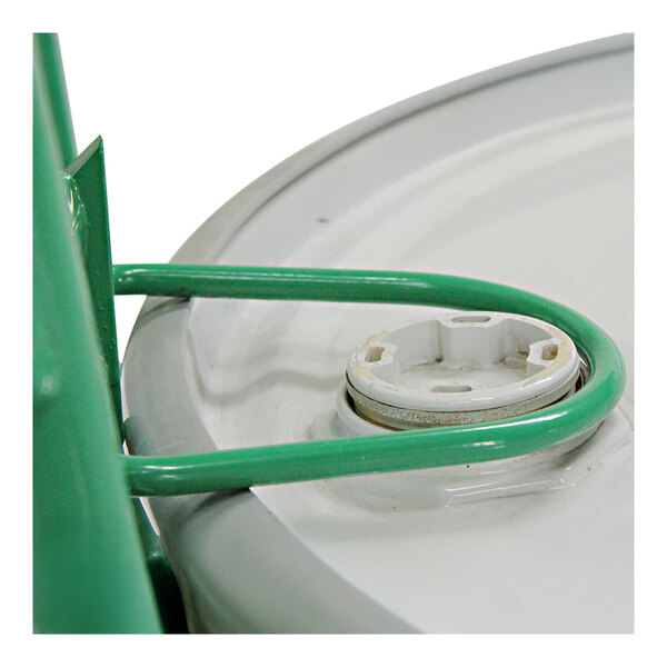 A white plastic drum chime hook with a green handle.