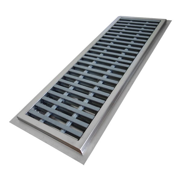 A stainless steel floor trough with a fiberglass square grid over a metal vent.