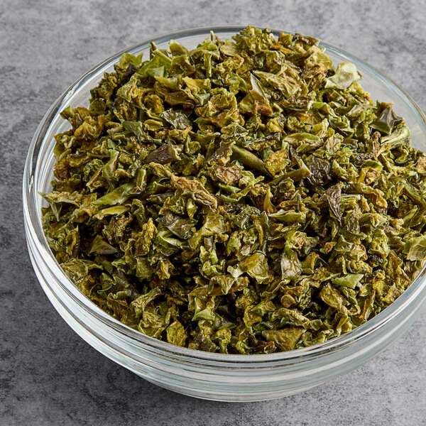 A bowl of Silva dried 1/4" diced green bell peppers.
