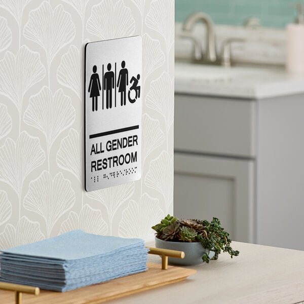A Lavex black aluminum restroom sign that says "All Gender Restroom" with silver letters and Braille.