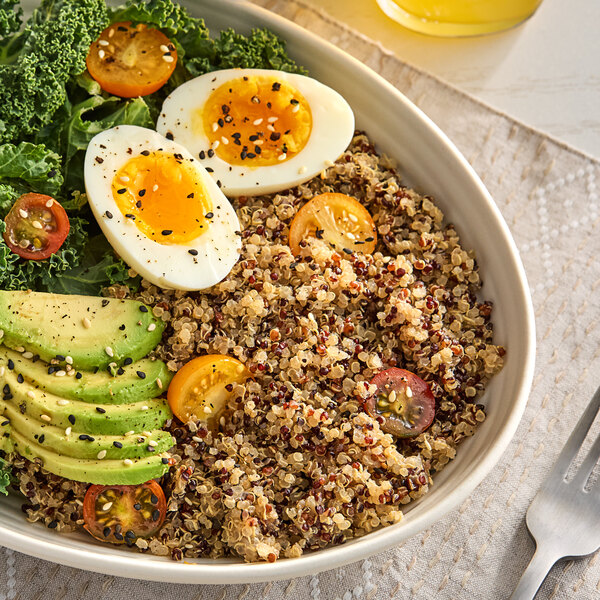 A bowl of quinoa with avocado.