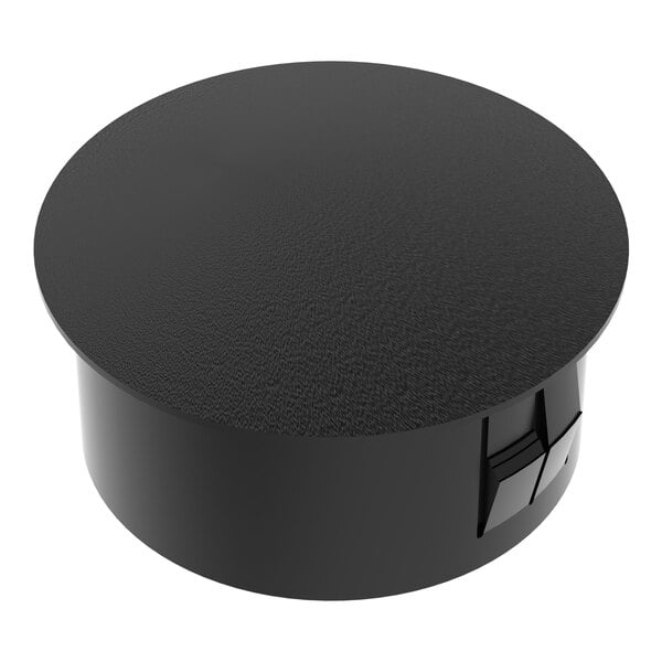 A round black plastic hole plug for shelving units.