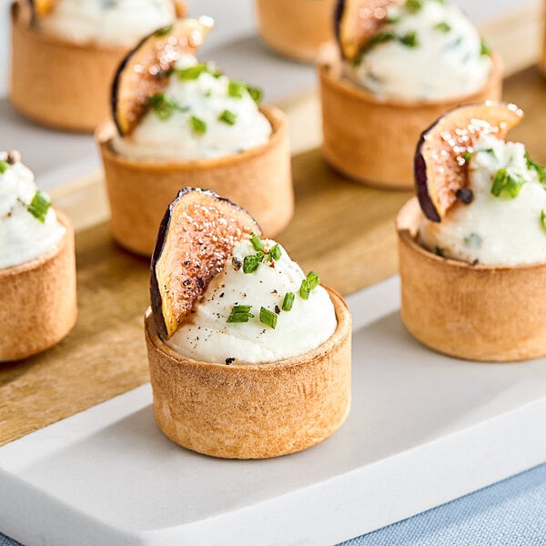 A close up of fig and goat cheese tarts in a White Toque tart shell.