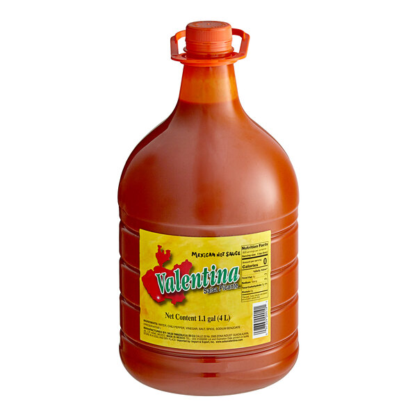 A large jug of Valentina Red Label Mexican Hot Sauce with a lid.