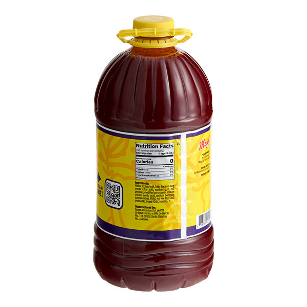 A close up of a brown Chamoy Mega Original Chamoy sauce bottle.