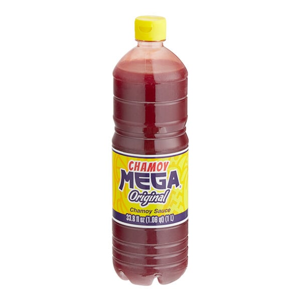 A close-up of a Chamoy Mega Original Chamoy Sauce bottle with a yellow cap.