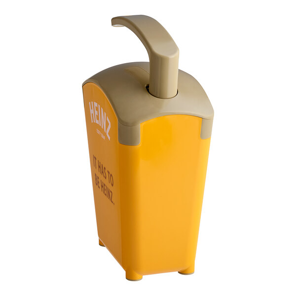 A yellow plastic Heinz countertop mustard pump dispenser with a handle.