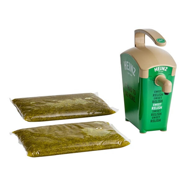 A green plastic Heinz pump dispenser next to two Heinz Sweet Relish pouches.