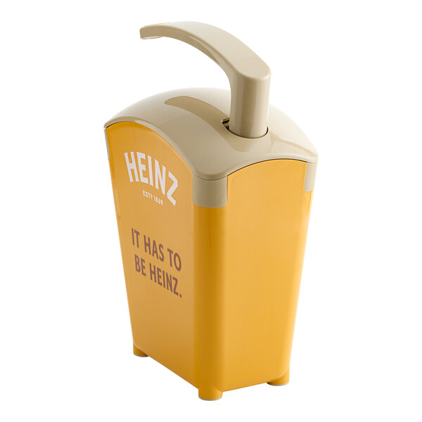 A yellow and white Heinz plastic countertop pump dispenser with a lid.