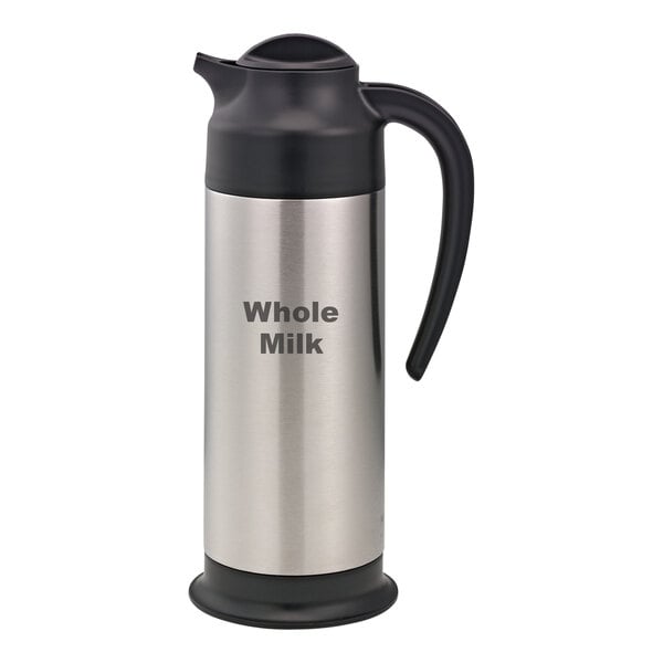 A stainless steel Service Ideas SteelVac creamer with a black lid and base that says "Whole Milk" on the front.