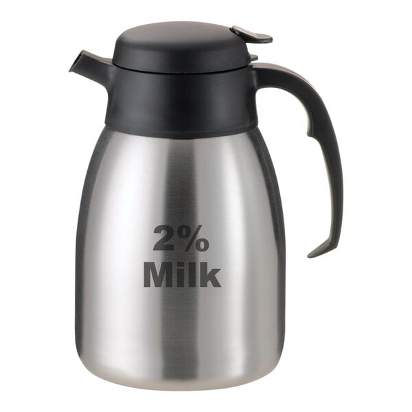 A stainless steel Service Ideas SteelVac creamer with a black lid and "2% Milk" in black.
